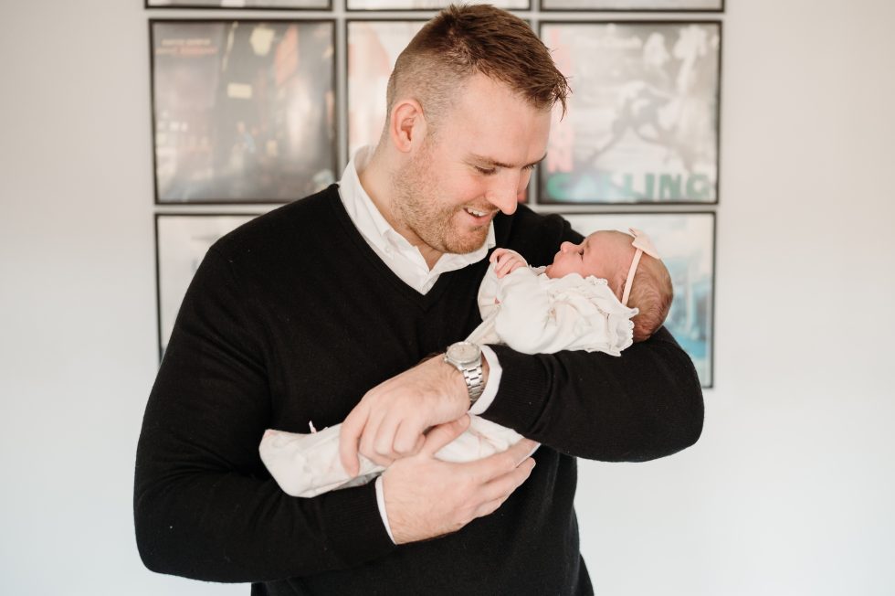 New dad looking down at his baby girl