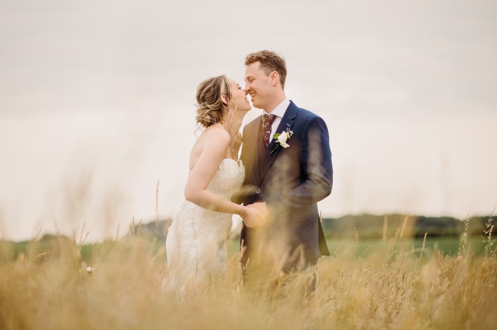 Bride and groom in a meadow in Lancashire