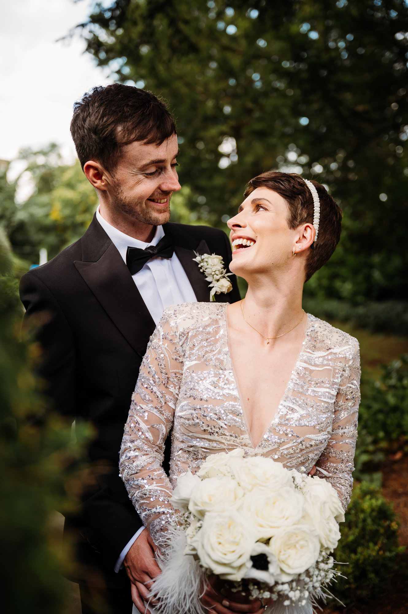 Bride is looking back at her new husband at a Manchester wedding