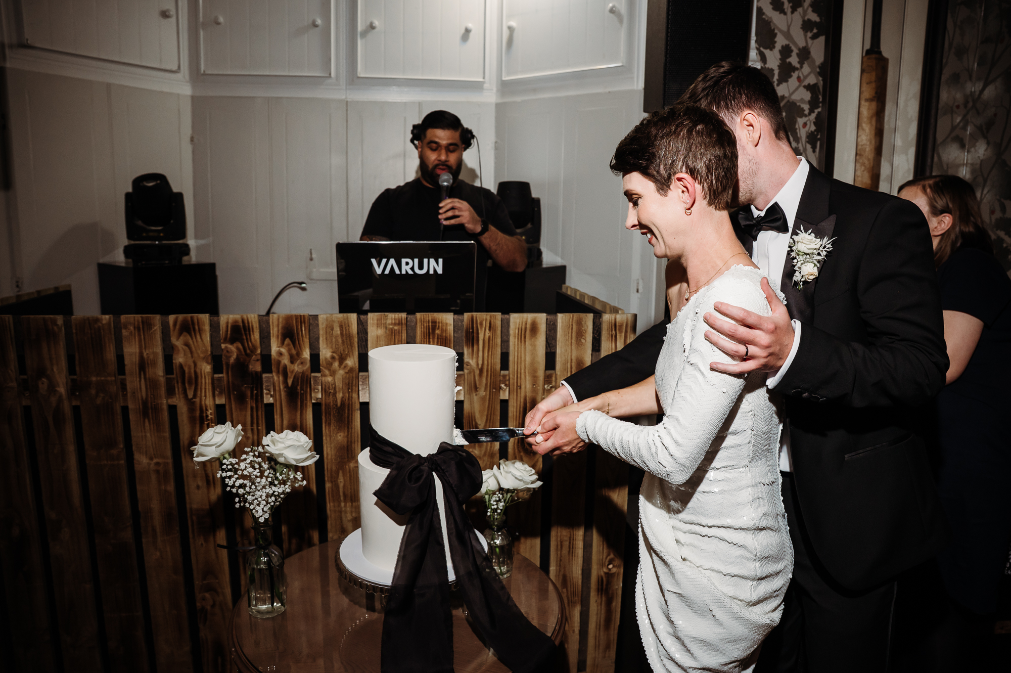 Bride and groom cutting their wedding cake