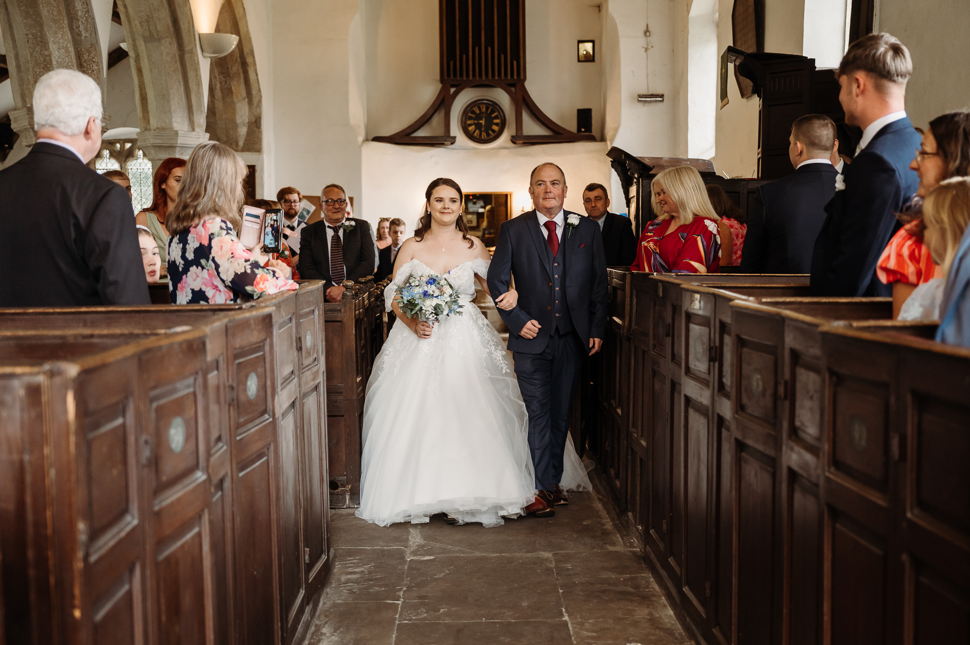 Father of the bride walking his daughter down the aisle