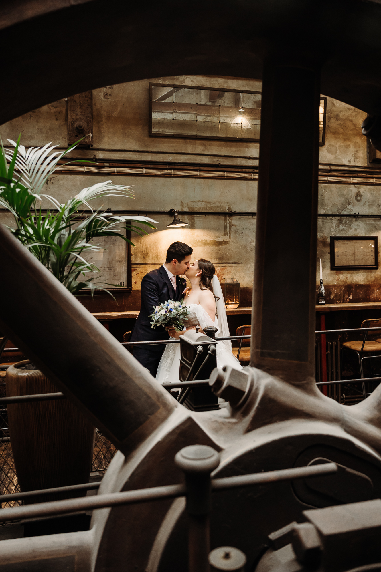 Bride and groom in the boiler room by Holmes Mill Wedding Photographer