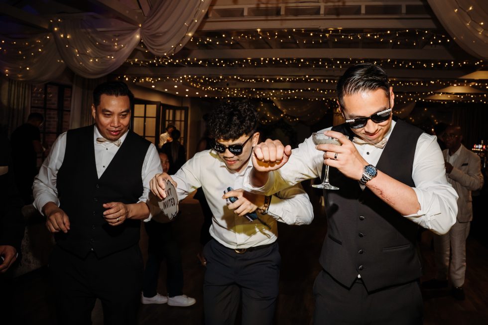 Wedding guests dancing with the groom at Bartle Hall