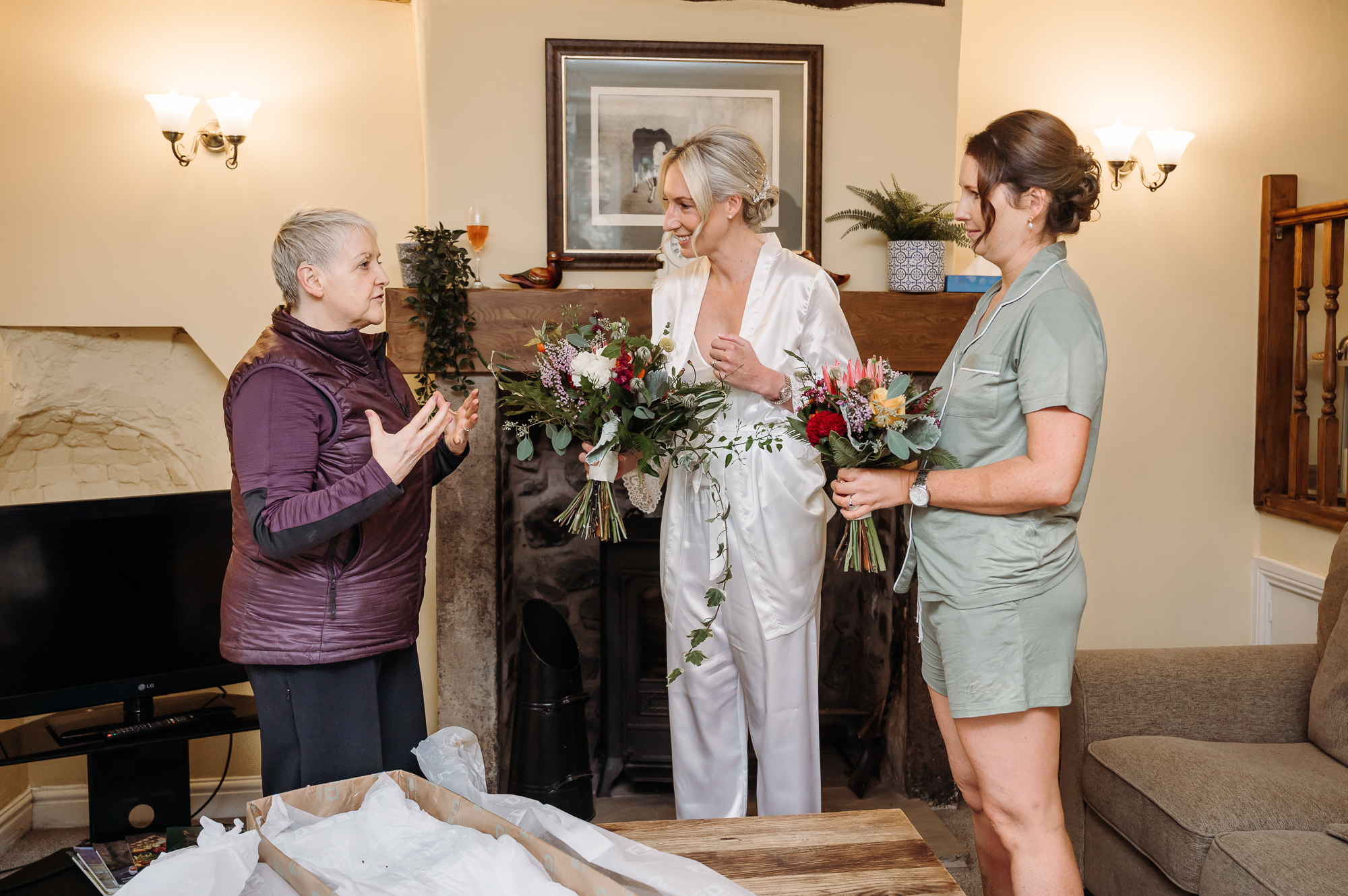 Bride and bridesmaids first look at the wedding bouquet