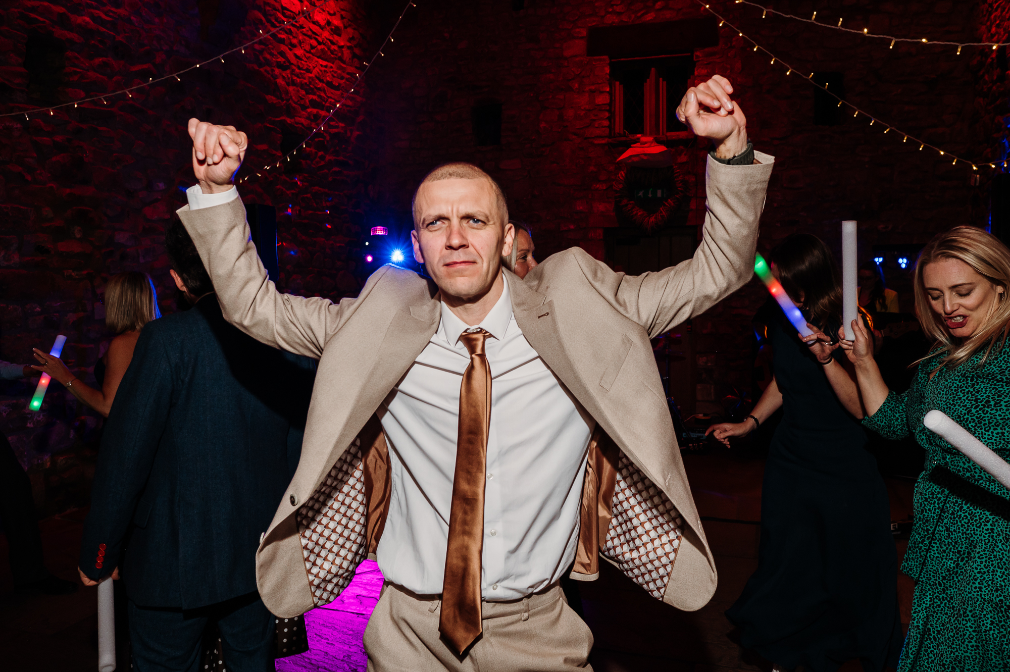 Wedding guest living his best life on the dance floor.