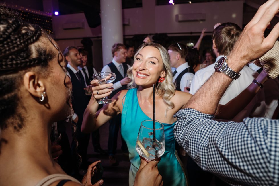 Dancing wedding guests by Lancashire wedding photographer
