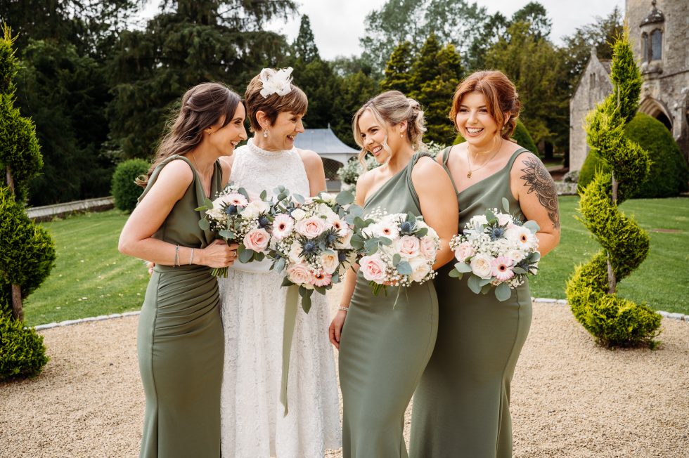 Bride and her bridesmaids laughing